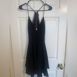 windsor lace back ruffle bottom black mini dress!